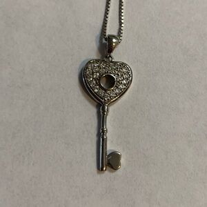Silver necklace with key pendant
